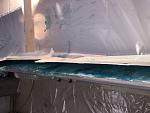 Fiberglass mat and polyester resin on both inside skins of the transom.  I needed to seal the pinholes.