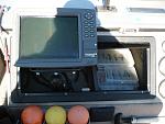 Tiller console with my Lowrance LCx104c. In the console is the outboard hr. meter & Rapala plug boxes/etc.